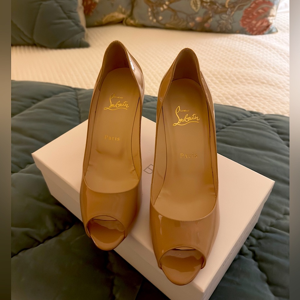 Christian Louboutin red bottom nude pumps